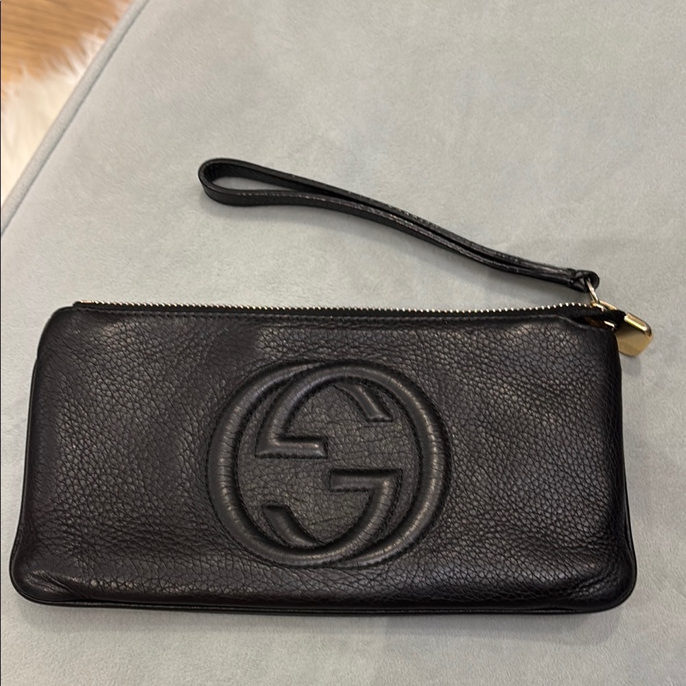 Authentic Gucci Black Leather Clutch with Gold Accent